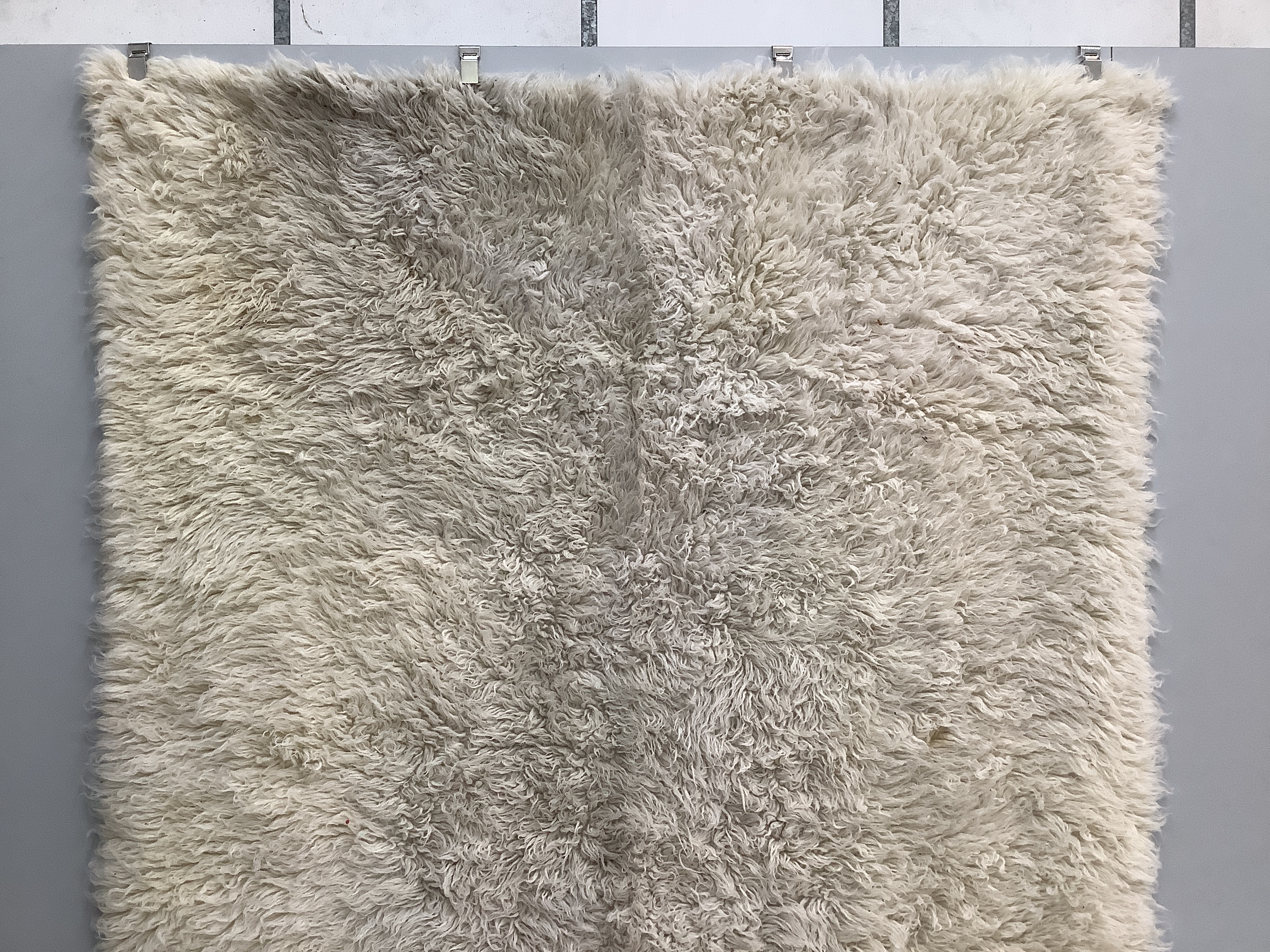 A faux sheepskin carpet, 290 x 200cm